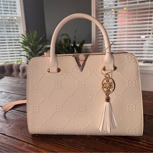 Elegant Cream Handbag with Tassel Charm